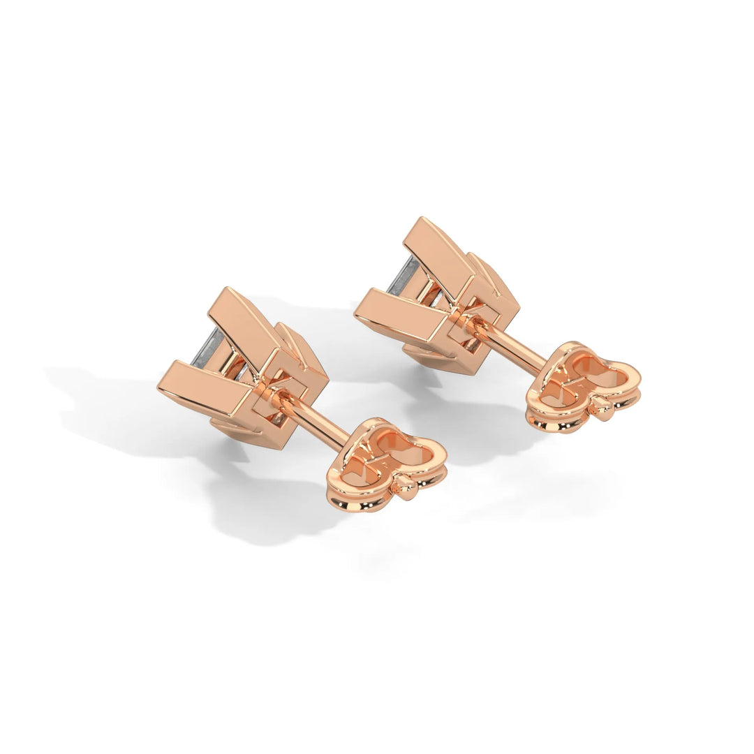 Rose gold cufflinks with a modern design on a white background.