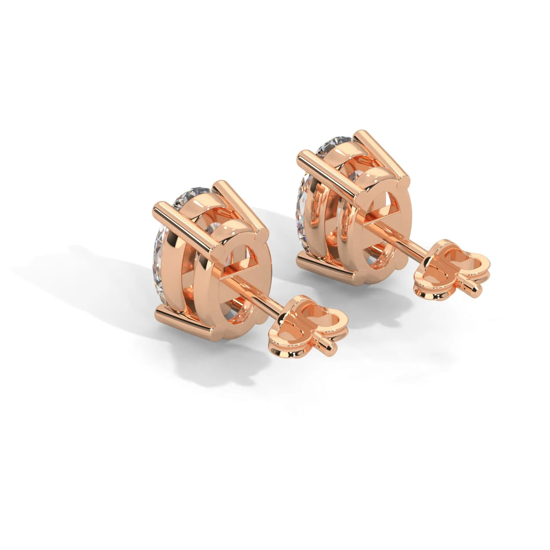 Rose gold cufflinks with a round transparent central stone.