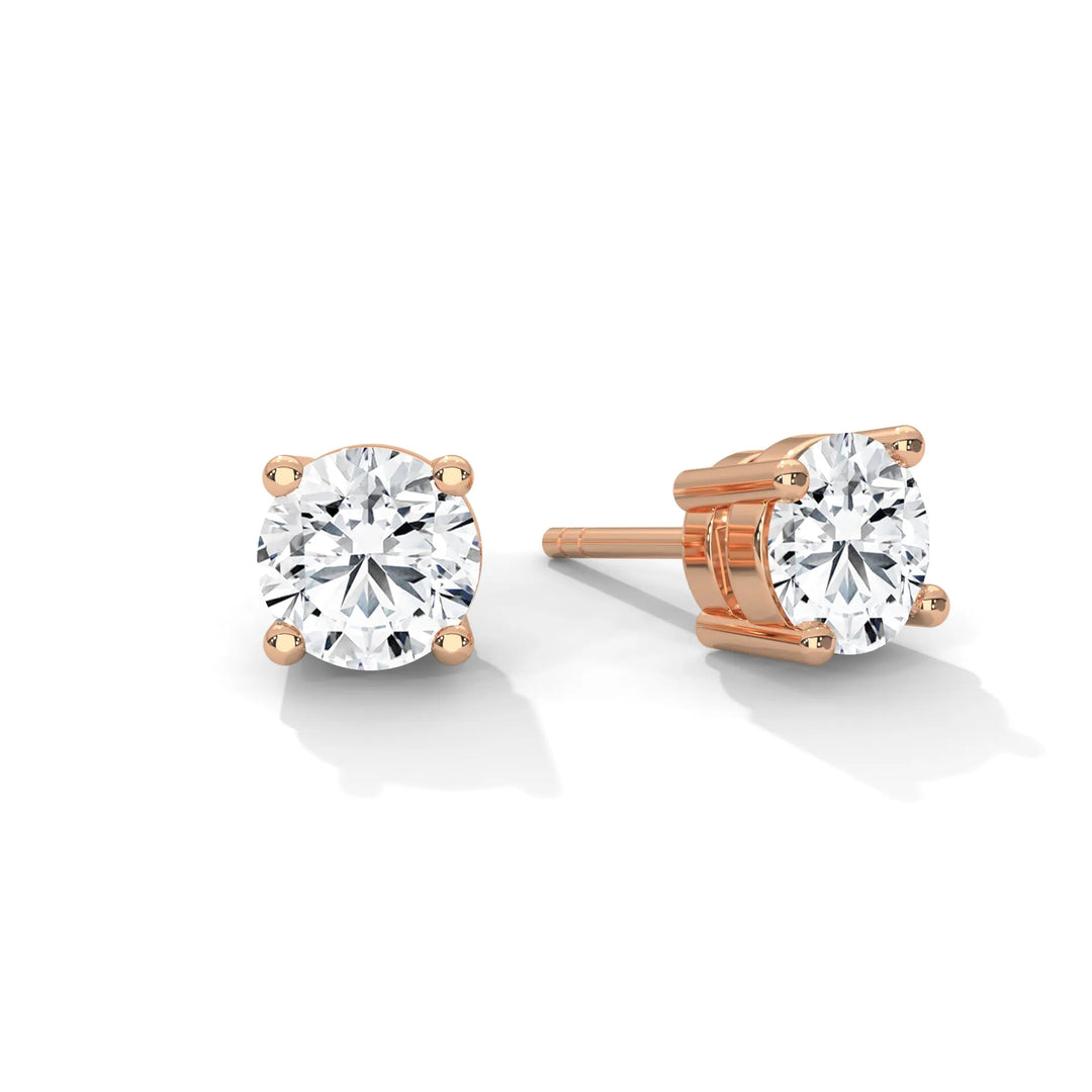 Rose gold diamond stud earrings sparkling elegantly perfect for adding a touch of glamour to any outfit.