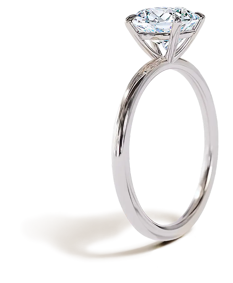 Side view of a white gold solitaire engagement ring featuring a round brilliant-cut diamond