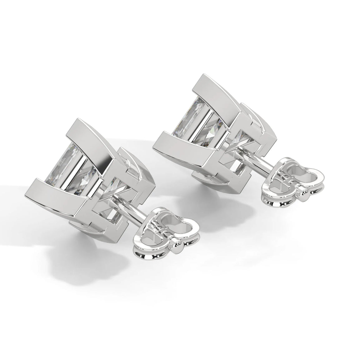 Silver cufflinks with rectangular design on a white background.