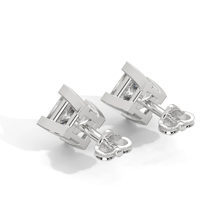 Silver cufflinks with rectangular gemstones on a white background.