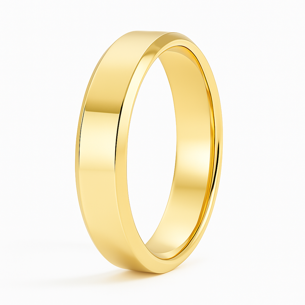 Simple gold wedding band with a smooth, polished surface, gleaming under bright light. The ring exudes elegance and timelessness against a white background.