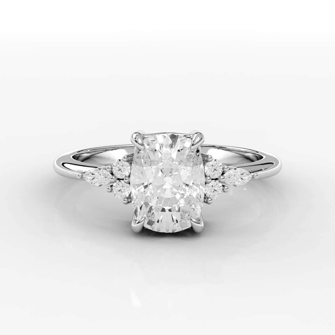 A sparkling engagement ring with a large oval diamond in the center, flanked by smaller round and marquise diamonds on a sleek silver band.