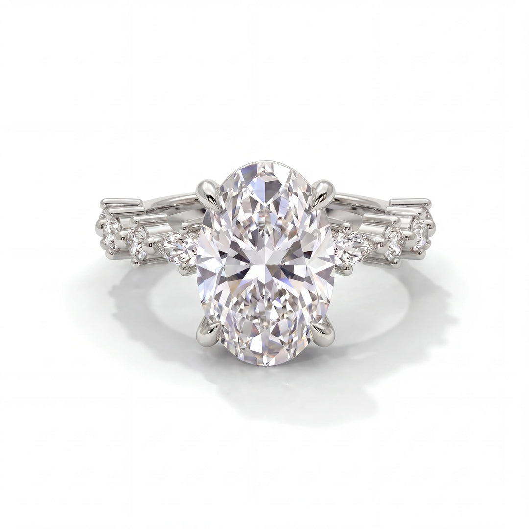 A sparkling oval diamond ring with intricate baguette and round diamonds on the band, set in a white gold setting, exuding elegance and luxury.