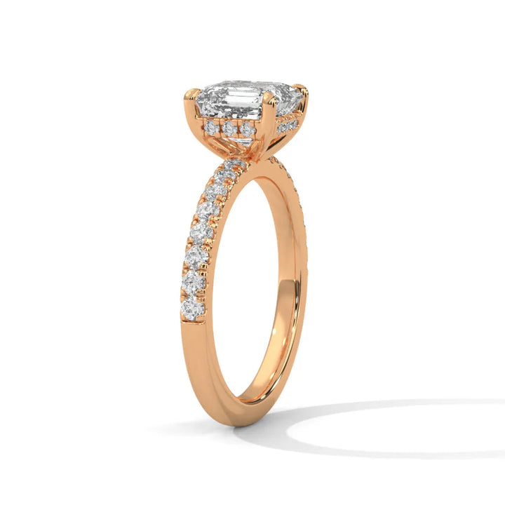 A beautiful rose gold engagement ring with an asscher 14k rose gold diamond centerpiece, crafted in a Sun Belt setting.