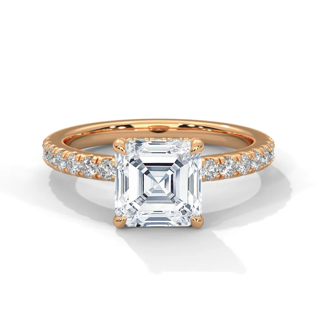 An exquisite asscher 14k diamond engagement ring in rose gold, highlighted by a sophisticated Sun Belt setting for a timeless look.