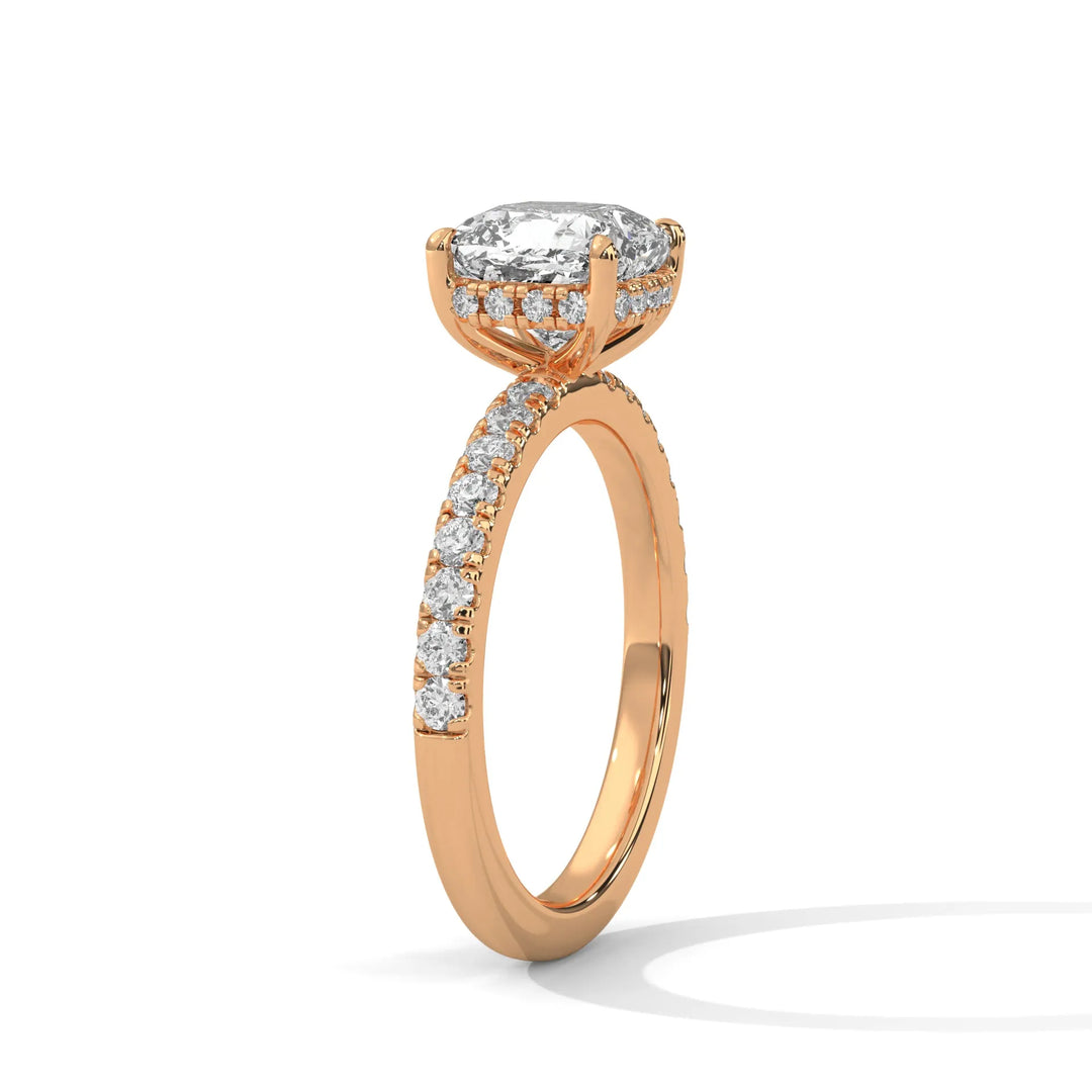 A beautiful rose gold engagement ring with an cushion 14k rose gold diamond centerpiece, crafted in a Sun Belt setting.