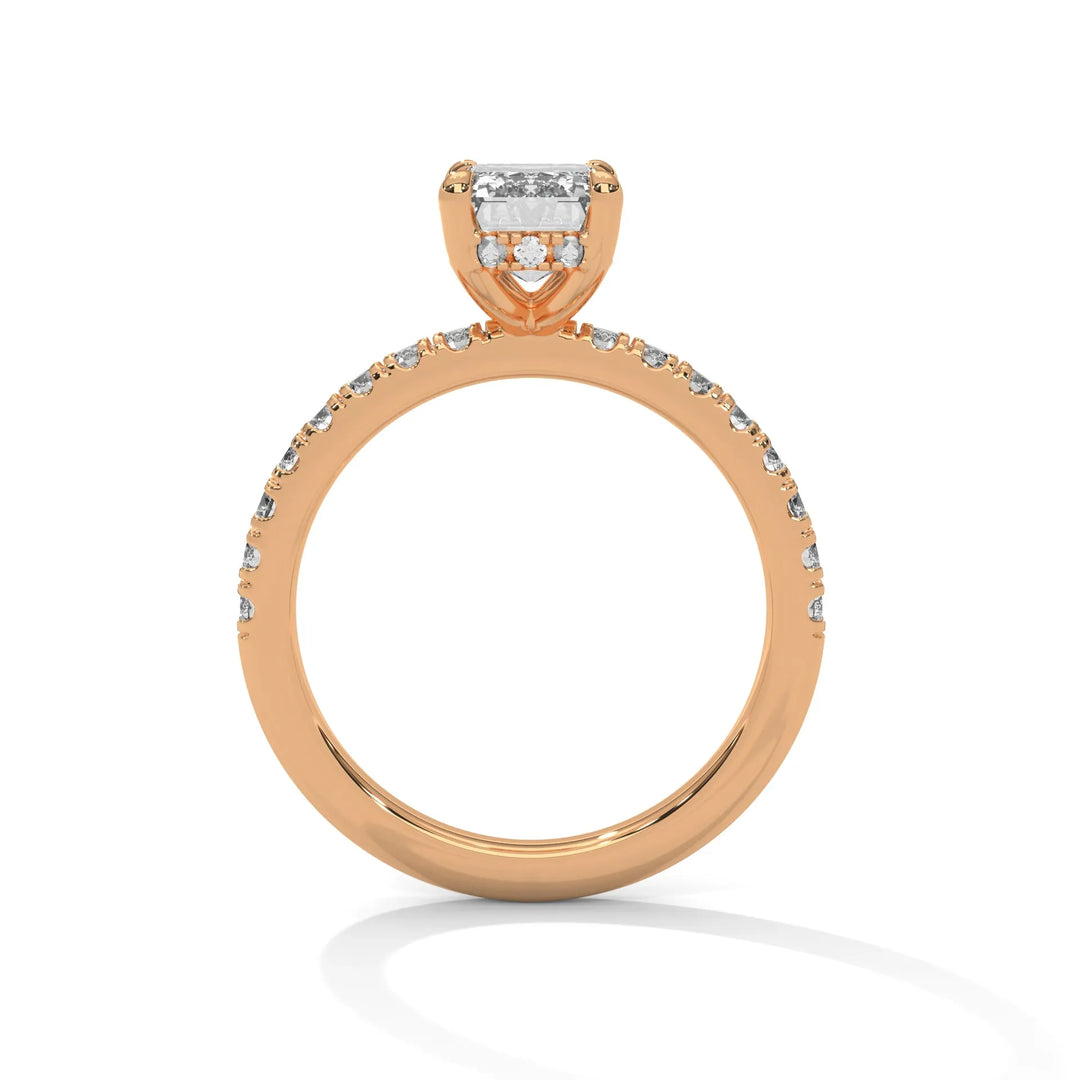 A rose gold engagement ring featuring a stunning emerald diamond center in a Sun Belt setting.