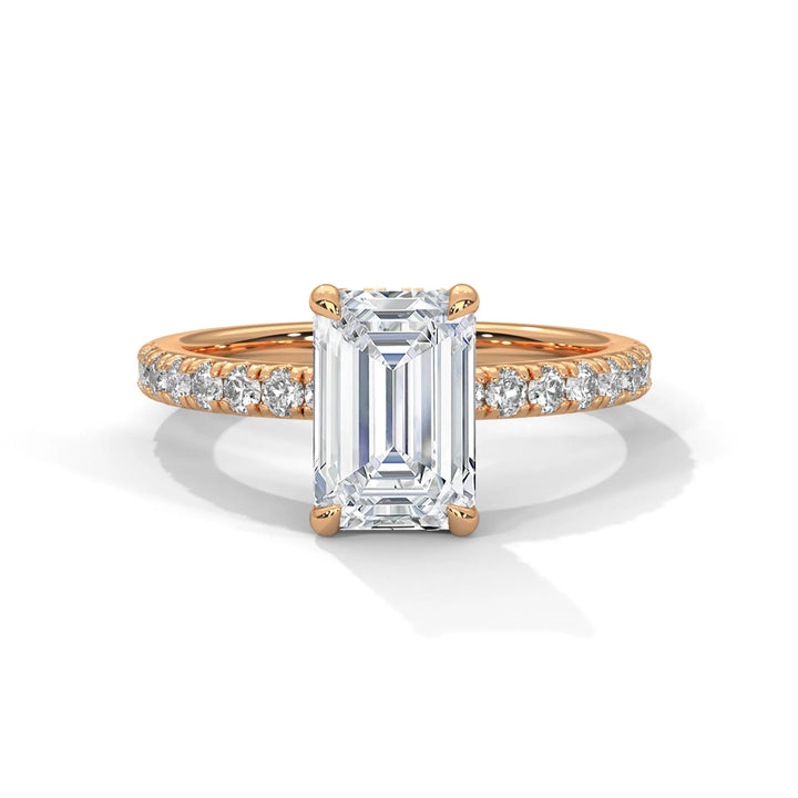 An exquisite emerald 14k diamond engagement ring in rose gold, highlighted by a sophisticated Sun Belt setting for a timeless look.