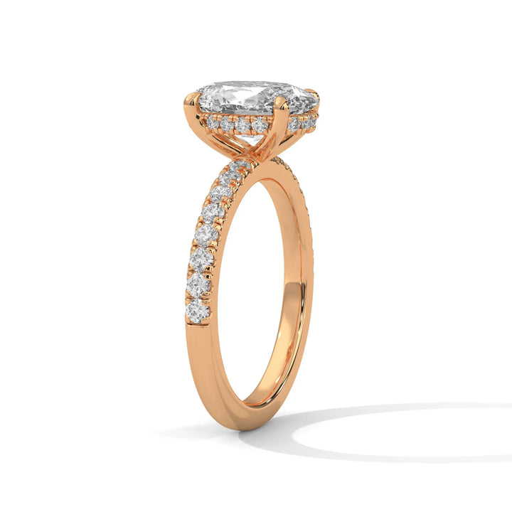 A beautiful rose gold engagement ring with an long cushion 14k rose gold diamond centerpiece, crafted in a Sun Belt setting.