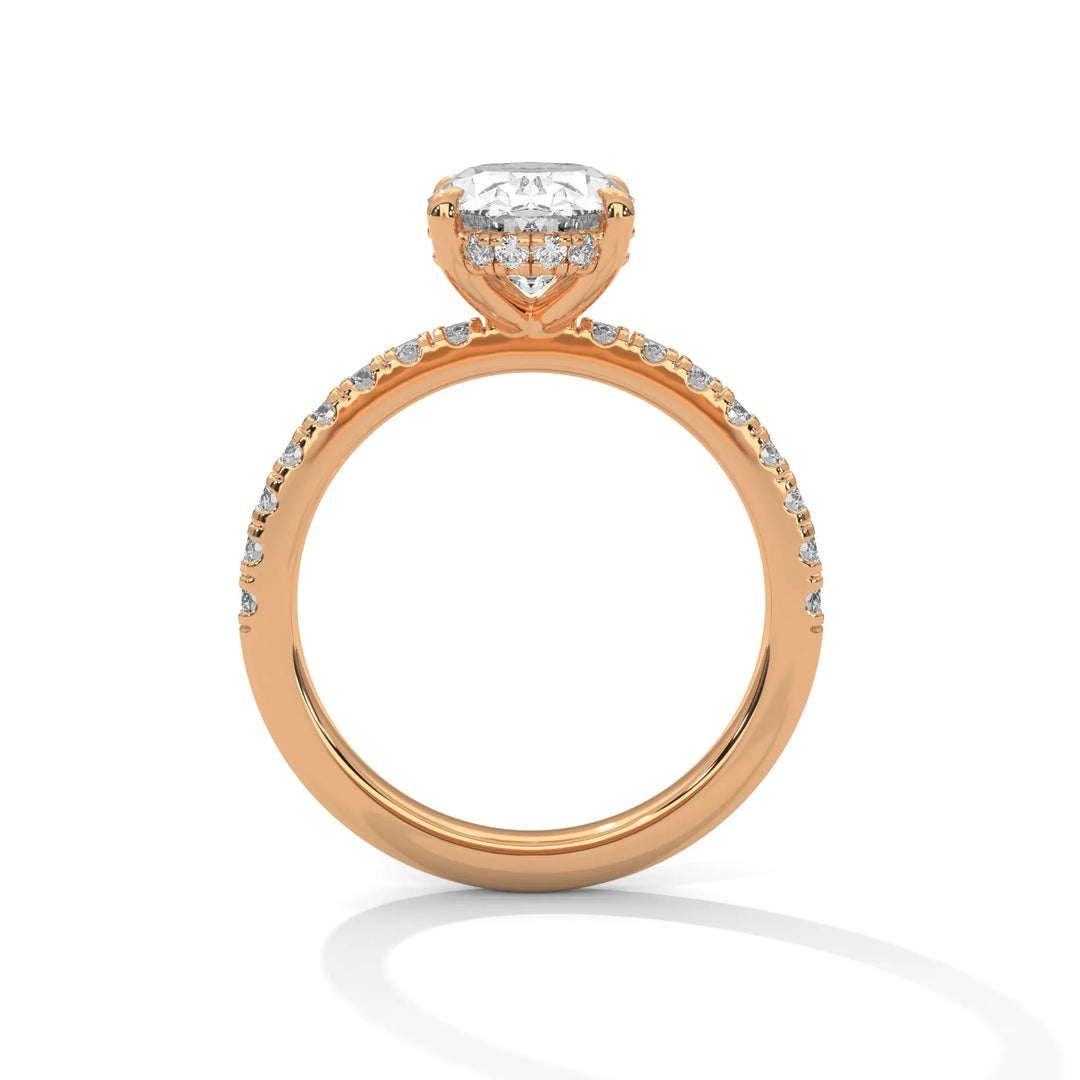 A rose gold engagement ring featuring a stunning long cushion diamond center in a Sun Belt setting.