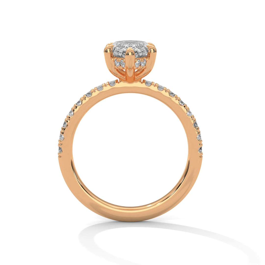 A rose gold engagement ring featuring a stunning marquise diamond center in a Sun Belt setting.