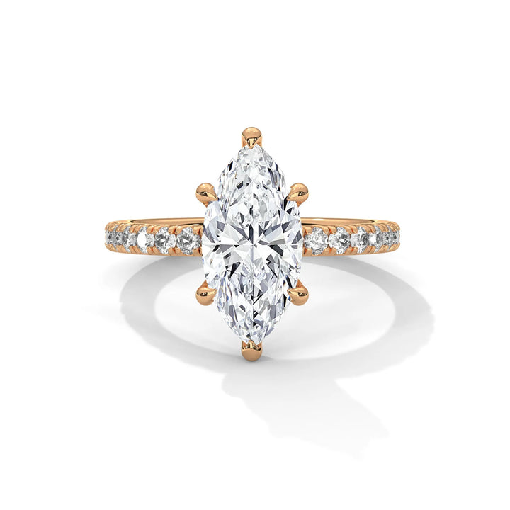 An exquisite marquise 14k diamond engagement ring in rose gold, highlighted by a sophisticated Sun Belt setting for a timeless look.