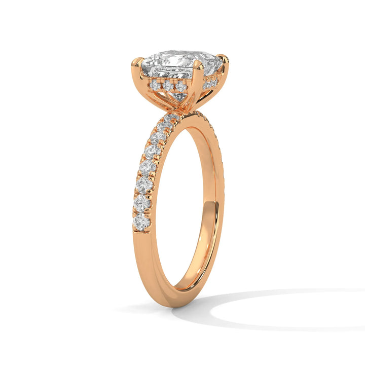 A beautiful rose gold engagement ring with an princess 14k rose gold diamond centerpiece, crafted in a Sun Belt setting.