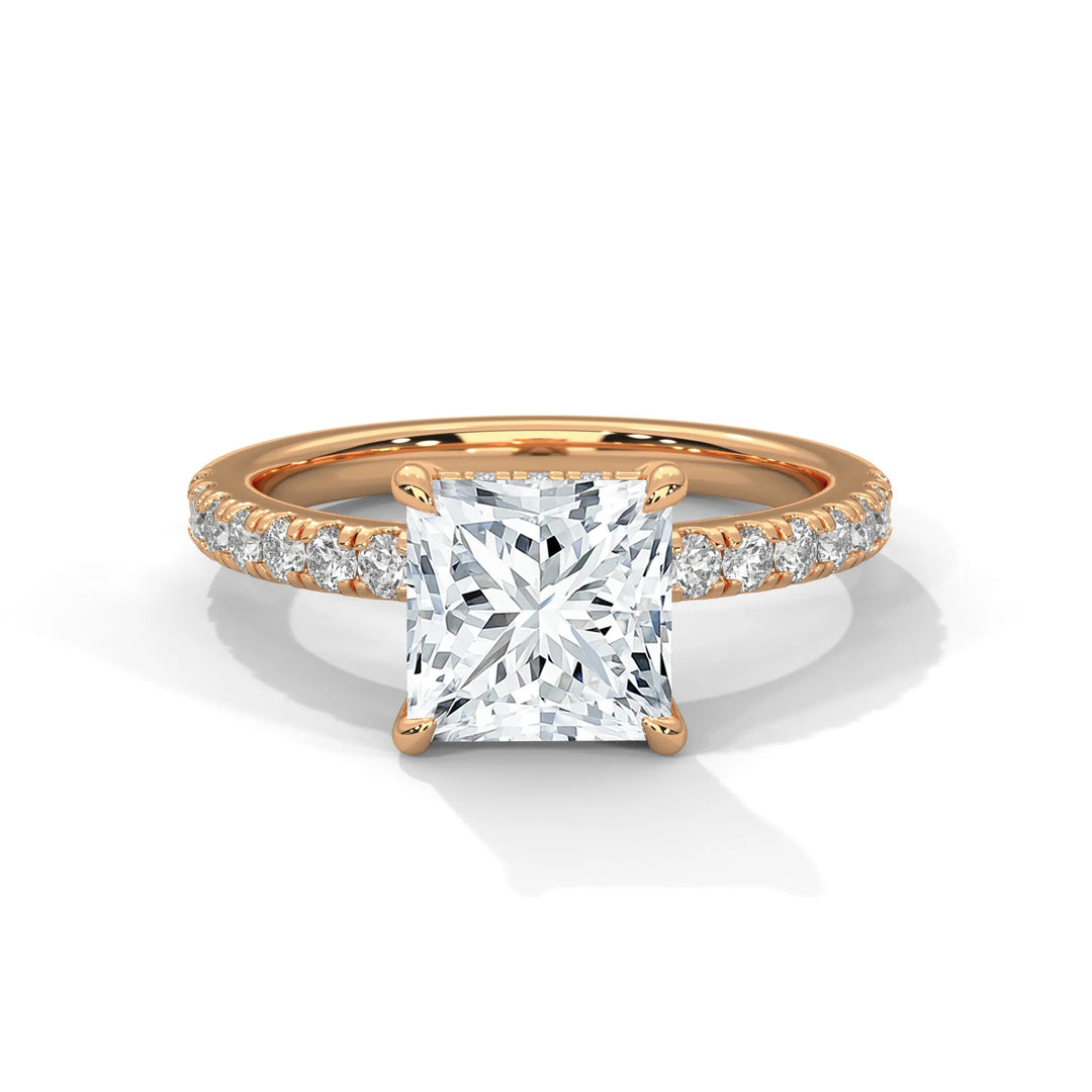 An exquisite princess 14k diamond engagement ring in rose gold, highlighted by a sophisticated Sun Belt setting for a timeless look.