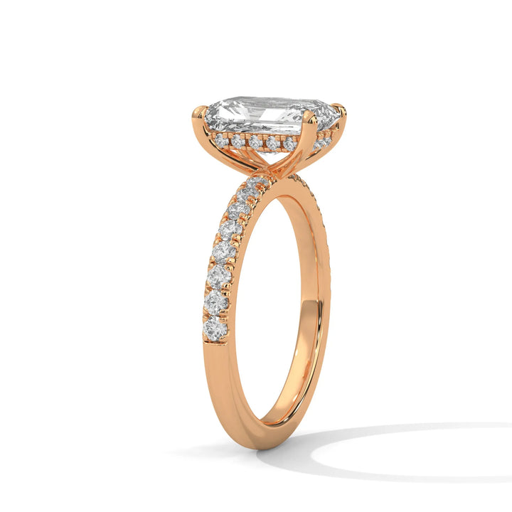 A beautiful rose gold engagement ring with an radiant 14k rose gold diamond centerpiece, crafted in a Sun Belt setting.