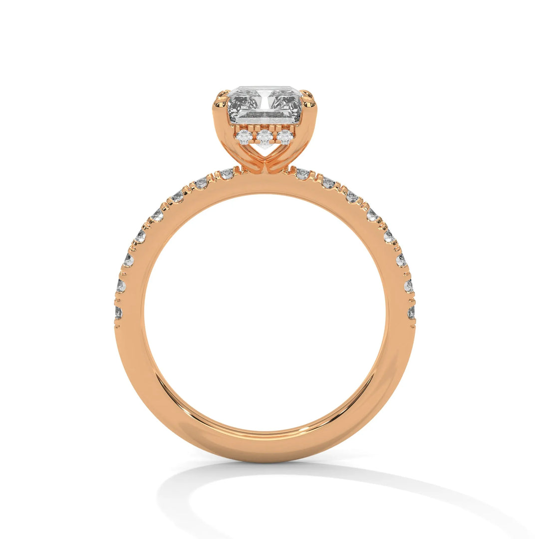 A rose gold engagement ring featuring a stunning radiant diamond center in a Sun Belt setting.