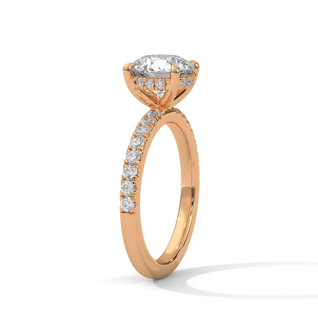 A beautiful rose gold engagement ring with an round 14k rose gold diamond centerpiece, crafted in a Sun Belt setting.