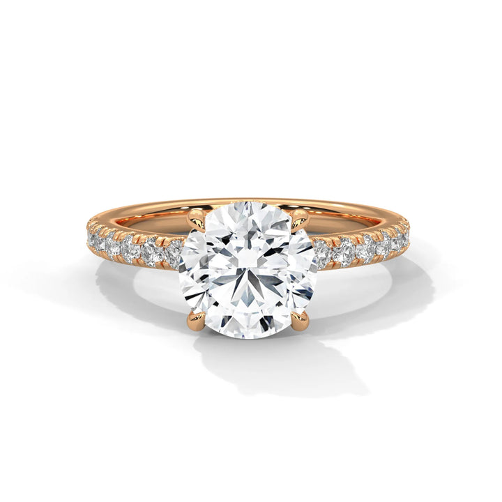 An exquisite round 14k diamond engagement ring in rose gold, highlighted by a sophisticated Sun Belt setting for a timeless look.