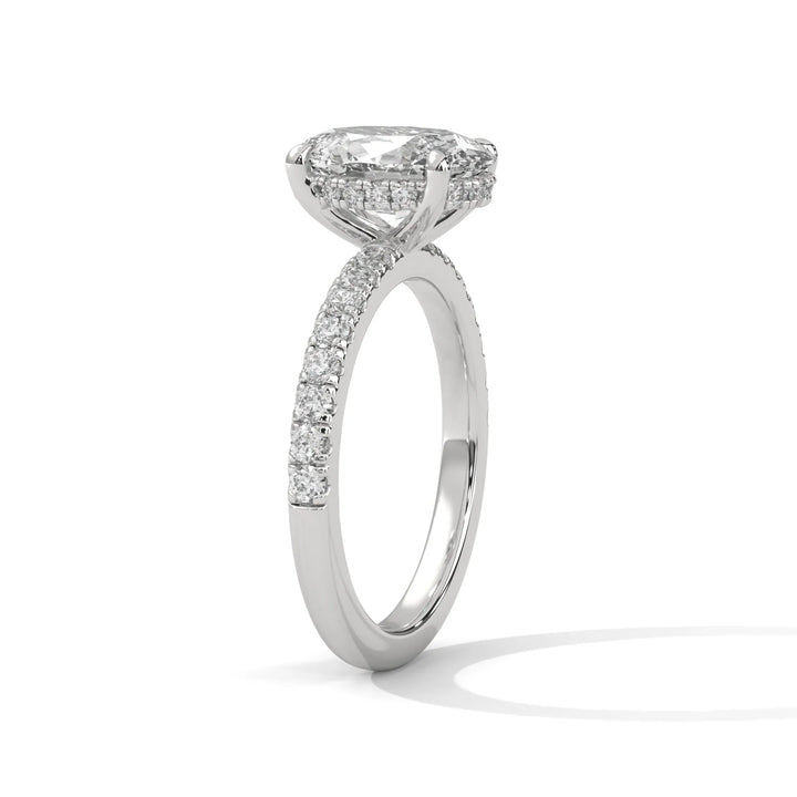 A beautiful white gold engagement ring with an long cushion 14k white gold diamond centerpiece, crafted in a Sun Belt setting.