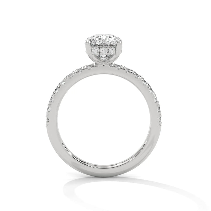 A white gold engagement ring featuring a stunning long cushion diamond center in a Sun Belt setting.