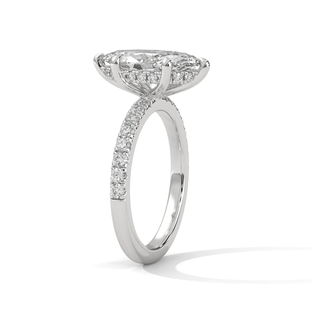 A beautiful white gold engagement ring with an marquise 14k white gold diamond centerpiece, crafted in a Sun Belt setting.