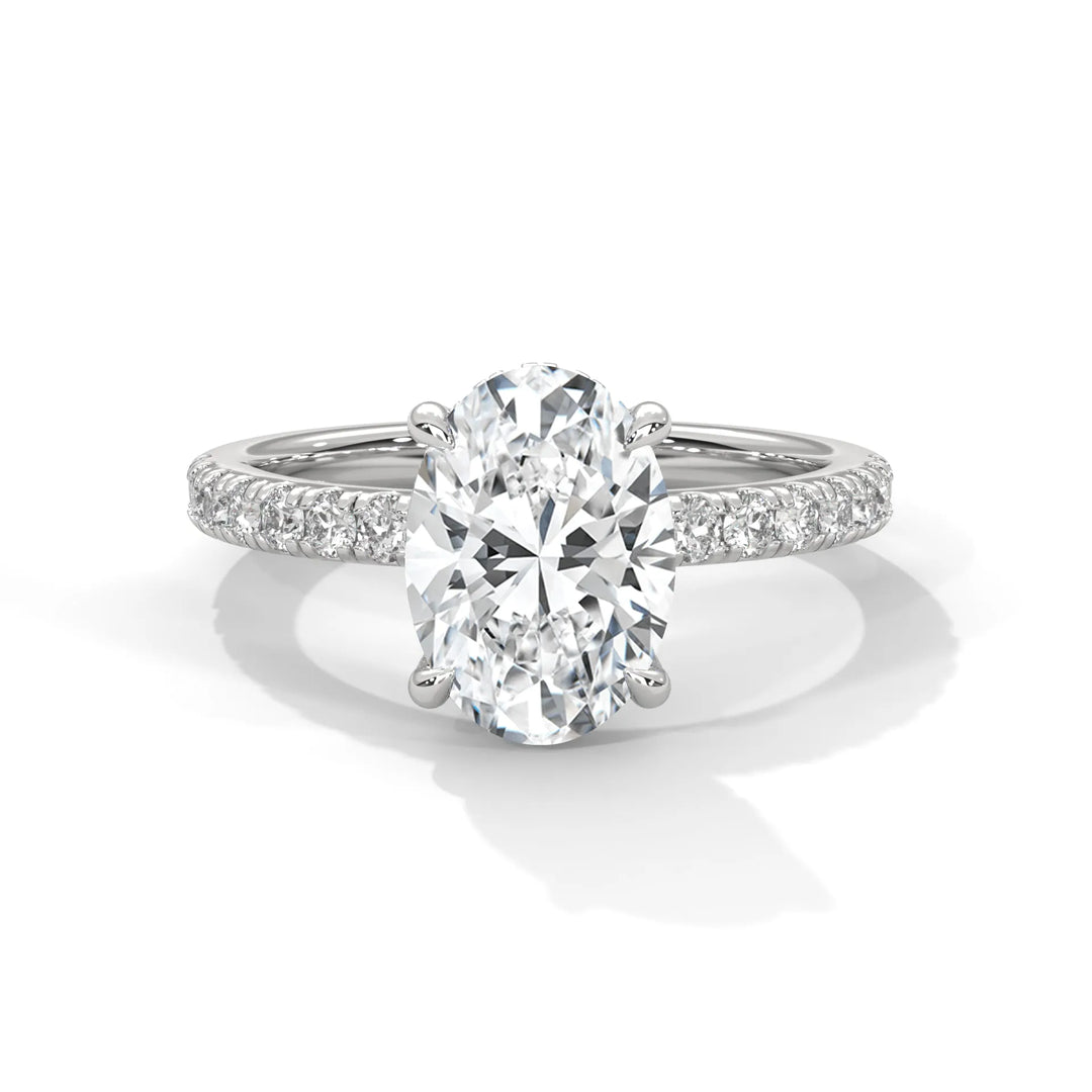 An exquisite oval 14k diamond engagement ring in white gold, highlighted by a sophisticated Sun Belt setting for a timeless look.