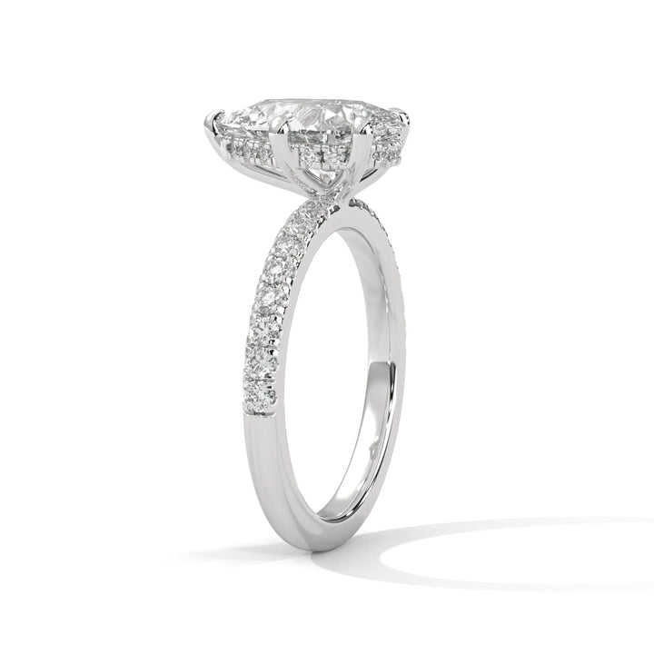 A beautiful white gold engagement ring with an pear 14k white gold diamond centerpiece, crafted in a Sun Belt setting.