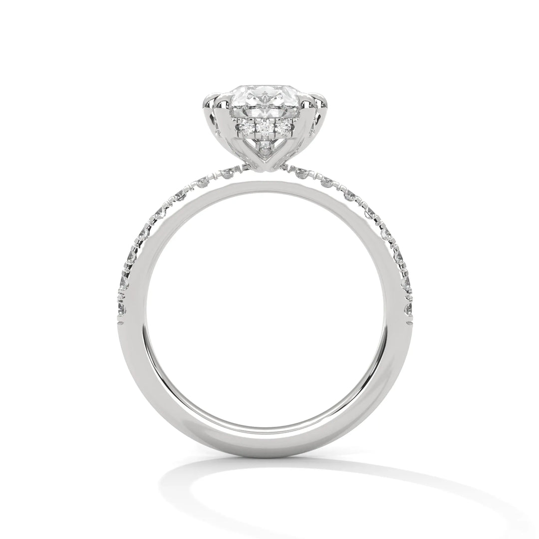 A white gold engagement ring featuring a stunning pear diamond center in a Sun Belt setting.