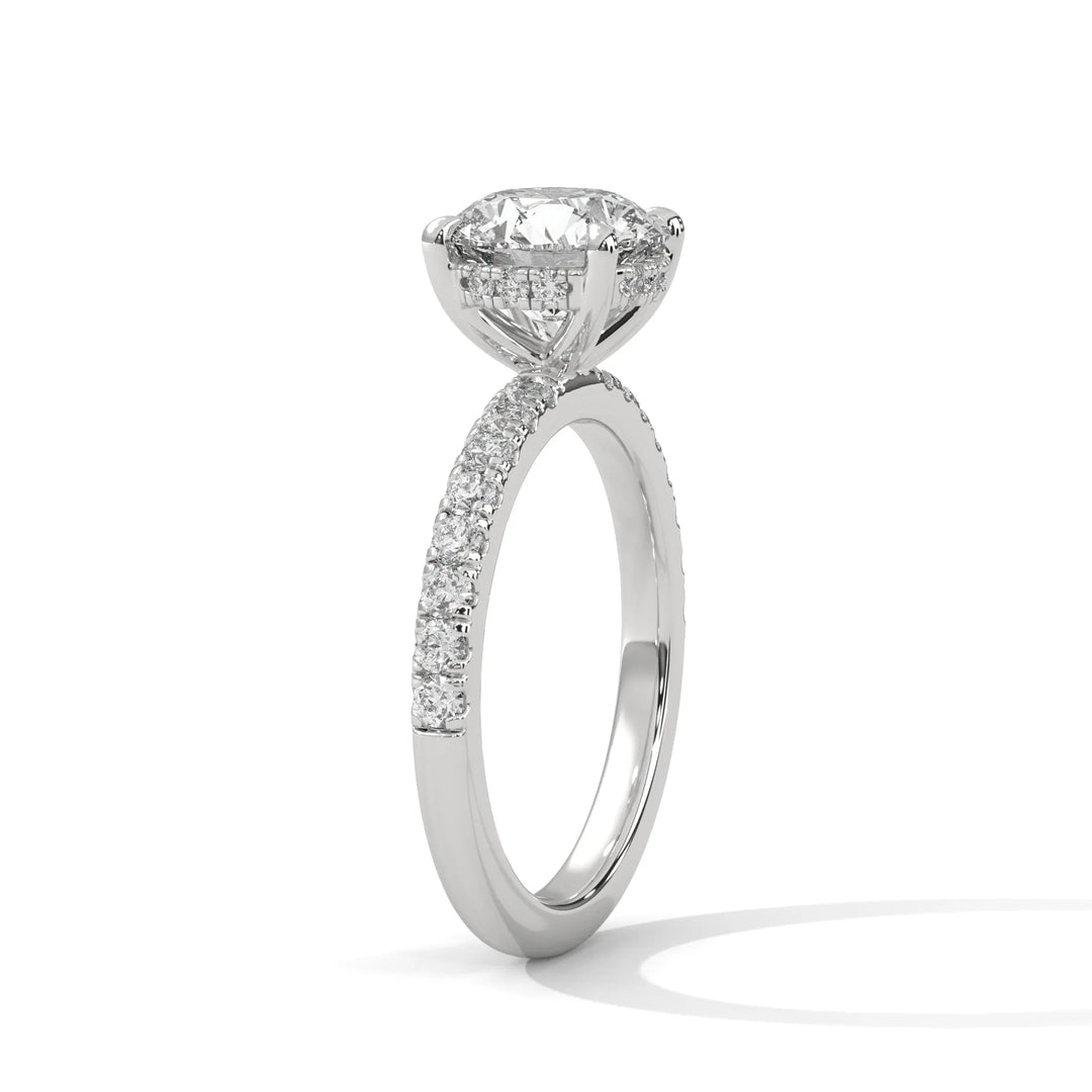 A beautiful white gold engagement ring with an round 14k white gold diamond centerpiece, crafted in a Sun Belt setting.