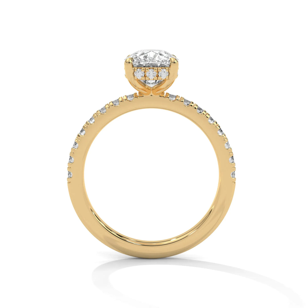 A yellow gold engagement ring featuring a stunning long cushion diamond center in a Sun Belt setting.