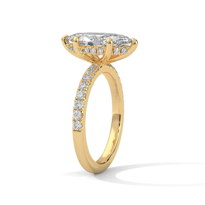 A beautiful yellow gold engagement ring with an marquise 14k yellow gold diamond centerpiece, crafted in a Sun Belt setting.