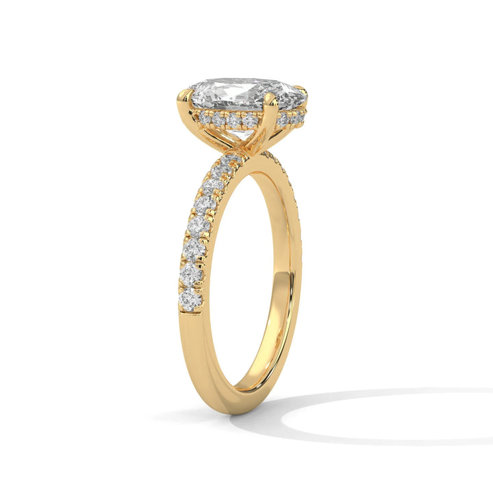 A beautiful yellow gold engagement ring with an oval 14k yellow gold diamond centerpiece, crafted in a Sun Belt setting.