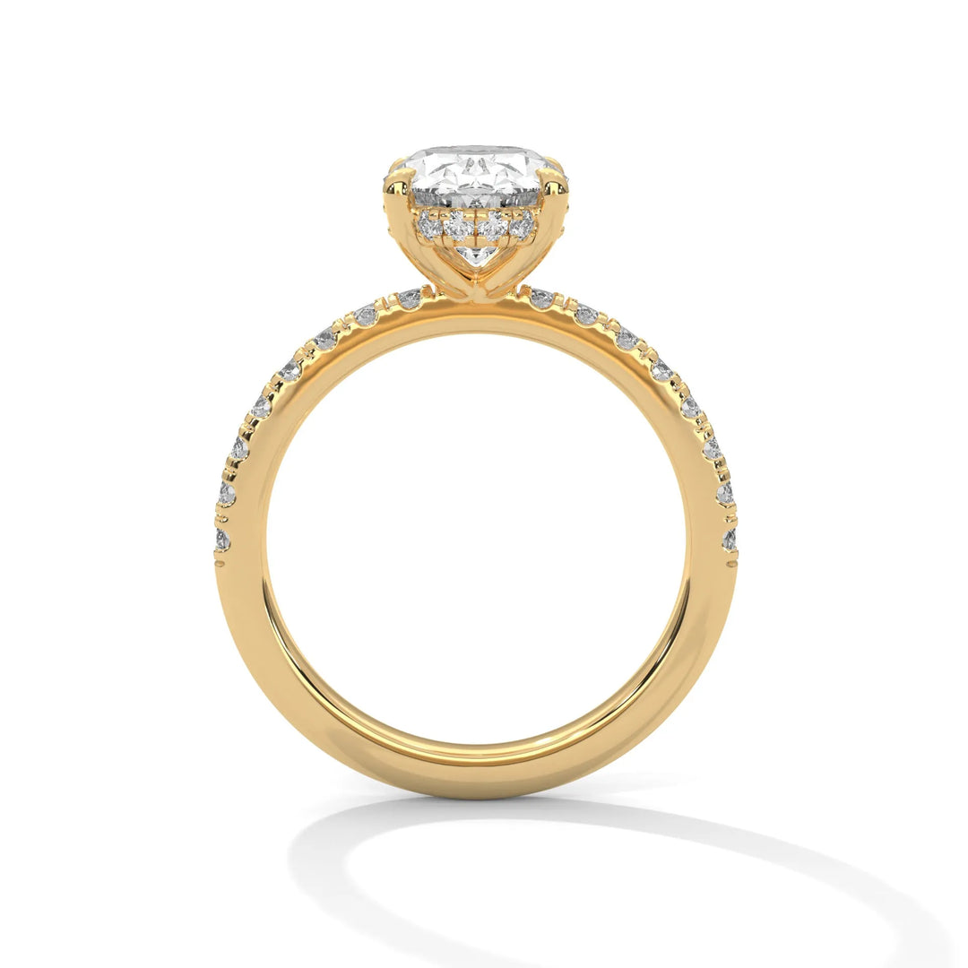 A yellow gold engagement ring featuring a stunning oval diamond center in a Sun Belt setting.