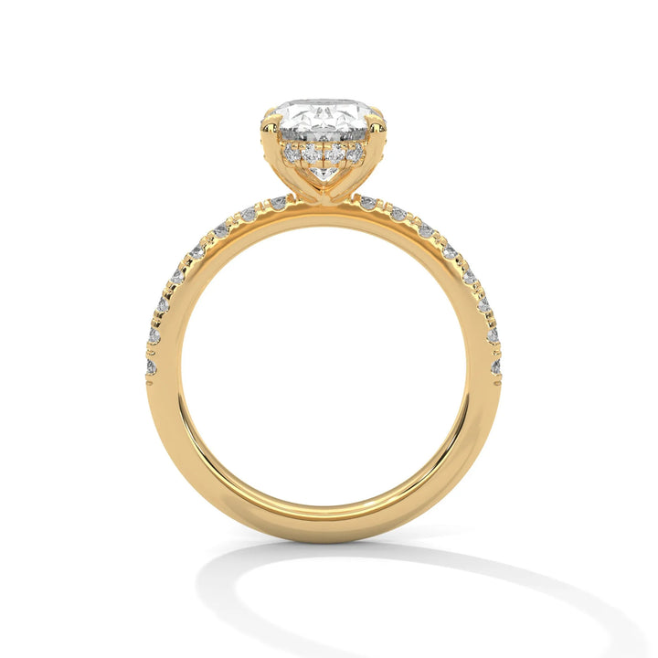 A yellow gold engagement ring featuring a stunning oval diamond center in a Sun Belt setting.