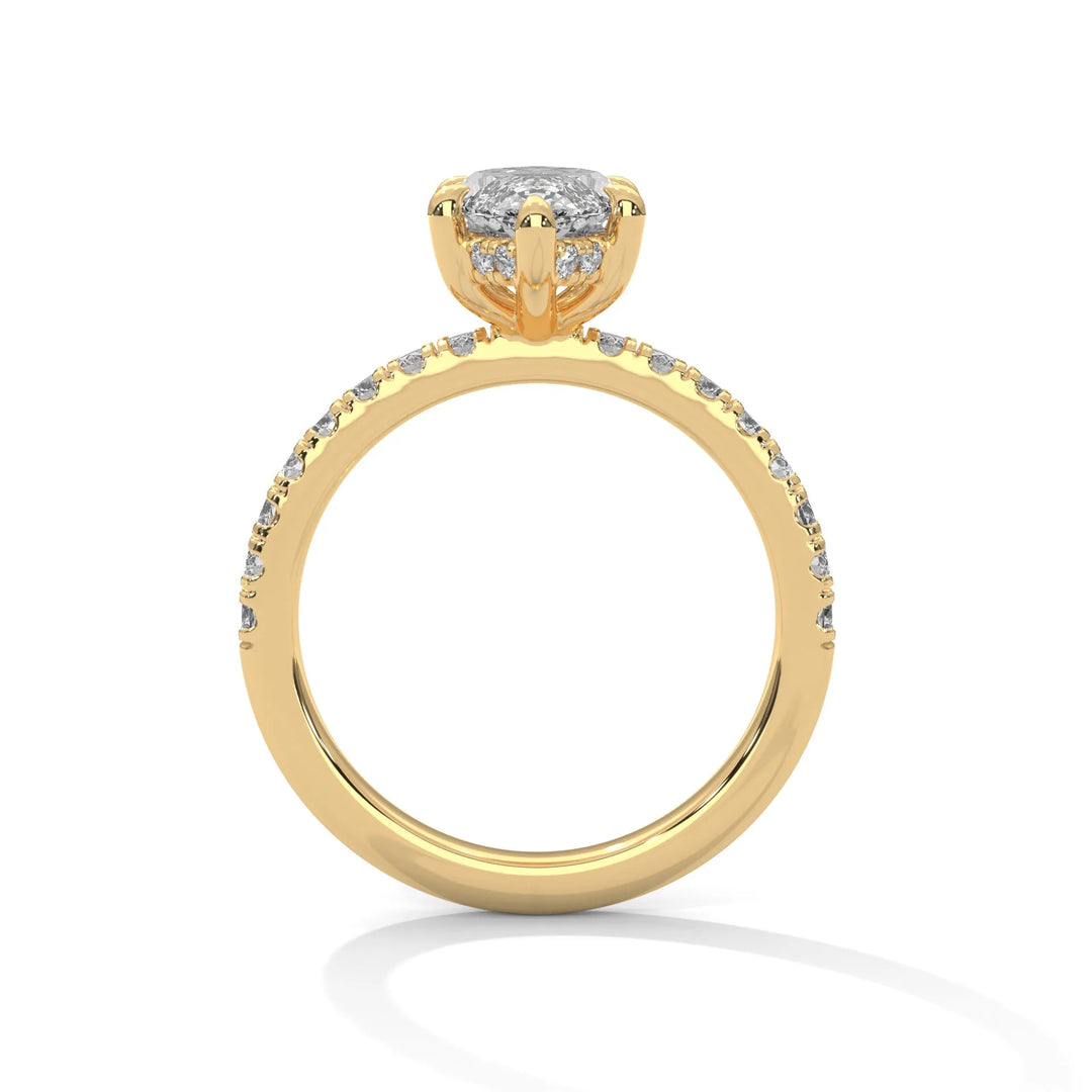 A yellow gold engagement ring featuring a stunning princess diamond center in a Sun Belt setting.