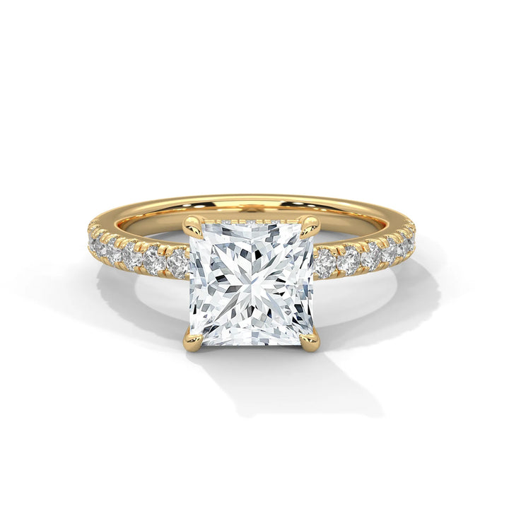 An exquisite princess 14k diamond engagement ring in yellow gold, highlighted by a sophisticated Sun Belt setting for a timeless look.