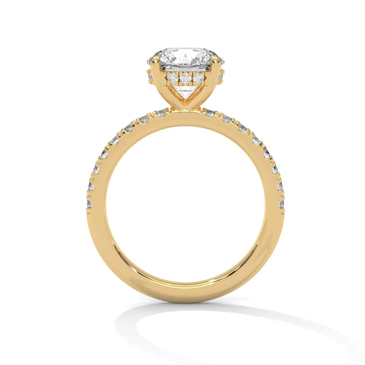 A yellow gold engagement ring featuring a stunning round diamond center in a Sun Belt setting.